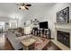 Bright living room with a fireplace, decorative shelves, and a view of the front entrance at 1056 Lukestone Dr, Fuquay Varina, NC 27526