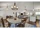 Spacious living room and dining area combo with hardwood floors at 1056 Lukestone Dr, Fuquay Varina, NC 27526