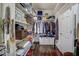 Organized walk-in closet with shelving and hanging racks for optimal storage solutions and hardwood floors at 1056 Lukestone Dr, Fuquay Varina, NC 27526