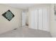 Well-lit bedroom features neutral carpet, white closets, and ample space for versatile use at 110 Hickory Dr, Spring Hope, NC 27882