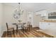 Charming dining area with a modern chandelier and glass table at 110 Hickory Dr, Spring Hope, NC 27882