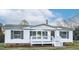 Charming home featuring a front porch, white siding, and black shutters at 110 Hickory Dr, Spring Hope, NC 27882