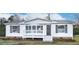 Inviting home with a covered front porch and well-maintained yard at 110 Hickory Dr, Spring Hope, NC 27882