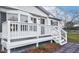 A front porch with white railings and steps for the entry to the home at 110 Hickory Dr, Spring Hope, NC 27882