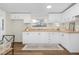 Bright kitchen featuring white cabinets, wooden countertops, and modern lighting at 110 Hickory Dr, Spring Hope, NC 27882