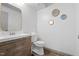 Modern bathroom featuring wood vanity, tile flooring, and new fixtures at 1110 Schaub Dr # B, Raleigh, NC 27606
