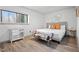 Comfortable bedroom with wood-look floors, accent wall art, and lots of natural light at 1110 Schaub Dr # B, Raleigh, NC 27606