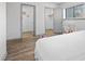 This is a bright bedroom with grey trim and luxury vinyl plank flooring at 1110 Schaub Dr # B, Raleigh, NC 27606