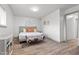 Bright bedroom featuring luxury vinyl plank flooring and natural light at 1110 Schaub Dr # B, Raleigh, NC 27606