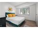 Bright bedroom featuring large window and modern finishes at 1110 Schaub Dr # B, Raleigh, NC 27606