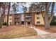 Apartment building featuring balconies, brick accents, and manicured landscaping, creating a welcoming appeal at 1110 Schaub Dr # B, Raleigh, NC 27606