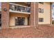 Apartment building showing brick and siding exterior with a sliding glass door and balcony at 1110 Schaub Dr # B, Raleigh, NC 27606