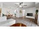 Open-concept living room and dining area with modern furnishings, hardwood floors, and a ceiling fan at 1110 Schaub Dr # B, Raleigh, NC 27606