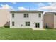 Rear exterior showcases a generous lawn and a concrete patio at 116 Pisgah St, Sanford, NC 27330