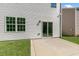 Rear exterior shows a concrete patio, sliding glass doors, and a classic white siding at 116 Pisgah St, Sanford, NC 27330
