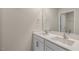 Bathroom featuring double sink vanity with bright natural light and a view into the water closet at 116 Pisgah St, Sanford, NC 27330