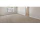Bedroom with carpet, window and a bathroom entryway at 116 Pisgah St, Sanford, NC 27330