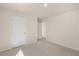 Bedroom with neutral carpet and two doorways allowing easy access throughout the home at 116 Pisgah St, Sanford, NC 27330