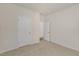 A bedroom with carpet, base trim and two doors at 116 Pisgah St, Sanford, NC 27330