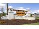 Elegant community entrance sign with brick pillars, wooden accents, and manicured landscaping at 116 Pisgah St, Sanford, NC 27330