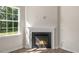 Close up on a living room fireplace with bright window at 116 Pisgah St, Sanford, NC 27330