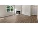 Bright living room featuring hardwood floors and fireplace at 116 Pisgah St, Sanford, NC 27330