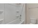 Bathroom featuring a shower and tub combo with built in shelving and a shower head at 116 Pisgah St, Sanford, NC 27330