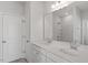 Bathroom featuring double sink vanity with white cabinets and quartz countertop at 120 Central Townes Way # 292, Raleigh, NC 27603