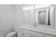 Bathroom featuring single sink vanity with white cabinets and quartz countertop at 120 Central Townes Way # 292, Raleigh, NC 27603