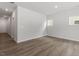 Spacious living room with hardwood floors, recessed lighting, and multiple windows for lots of light at 120 Central Townes Way # 292, Raleigh, NC 27603