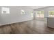 Open living room featuring hardwood floors, recessed lighting, large windows, and lots of natural light at 120 Central Townes Way # 292, Raleigh, NC 27603