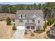 Expansive aerial view showcasing the home's architecture, landscaping, and surrounding greenery at 126 Filigree Way, Durham, NC 27713