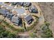Aerial view of the property showcasing the home, surrounding landscaping, and cul-de-sac at 126 Filigree Way, Durham, NC 27713