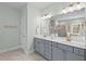 Bathroom features double sinks, gray cabinets, and modern light fixtures at 126 Filigree Way, Durham, NC 27713