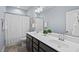 Clean bathroom featuring a double sink vanity and shower with white fixtures at 126 Filigree Way, Durham, NC 27713