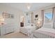 Charming bedroom with twin beds, dresser, and decor with bathroom access at 126 Filigree Way, Durham, NC 27713