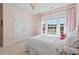 Bright bedroom with large windows and double closets, offering ample storage at 126 Filigree Way, Durham, NC 27713