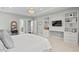 Stylish bedroom features a bed, built-in shelves, workspace, and a muted color palette at 126 Filigree Way, Durham, NC 27713