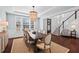 Dining room boasts hardwood floors, coffered ceilings, and a decorative chandelier at 126 Filigree Way, Durham, NC 27713