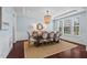 Elegant dining room with hardwood floors, decorative lighting fixture, and ample natural light at 126 Filigree Way, Durham, NC 27713