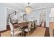 Cozy dining room with hardwood floors, coffered ceilings, and a large dining table at 126 Filigree Way, Durham, NC 27713