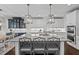 Spacious kitchen with large island, granite counters, pendant lights, and stainless appliances at 126 Filigree Way, Durham, NC 27713