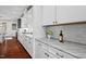 Stylish kitchen with white cabinetry, granite countertops, and stainless steel appliances at 126 Filigree Way, Durham, NC 27713