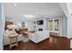 Bright living room featuring hardwood floors, a fireplace, and plenty of natural light at 126 Filigree Way, Durham, NC 27713