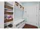 Functional mudroom with built-in storage and a convenient bench seating area at 126 Filigree Way, Durham, NC 27713