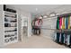 Bright, spacious walk-in closet with custom shelving for organized storage at 126 Filigree Way, Durham, NC 27713