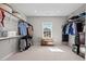Bright, spacious walk-in closet with custom shelving and a window for natural light at 126 Filigree Way, Durham, NC 27713