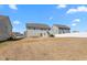 The expansive backyard features a fence and is surrounded by similar-style houses at 130 Campaign Dr, Mebane, NC 27302