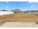 A spacious backyard is enclosed by a white fence, offering privacy and room to enjoy at 130 Campaign Dr, Mebane, NC 27302