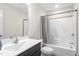Clean bathroom featuring a combination shower and tub, a modern vanity, and neutral tones at 130 Campaign Dr, Mebane, NC 27302